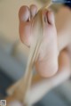 A close up of a person's feet with a pair of socks.