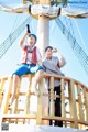 A man and a woman sitting on top of a boat.